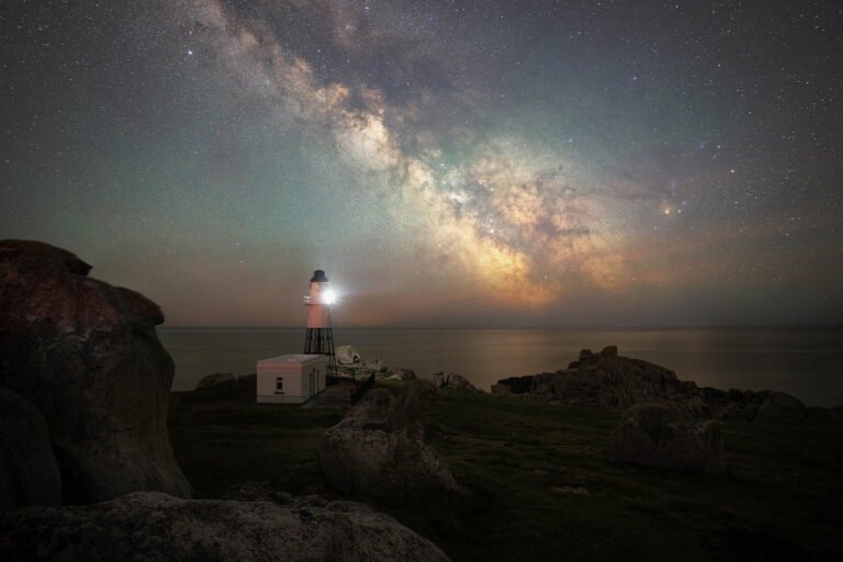 Milky Way over Peninnis Lighthouse, Isles of Scilly. Taken on our Cornwall photography workshop and tour.